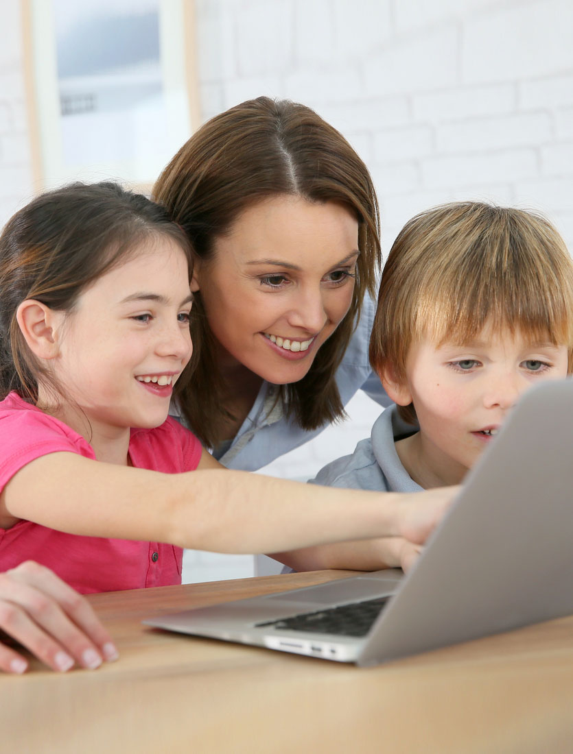 Discover DNA - mother with kids at home using laptop for learning about DNA